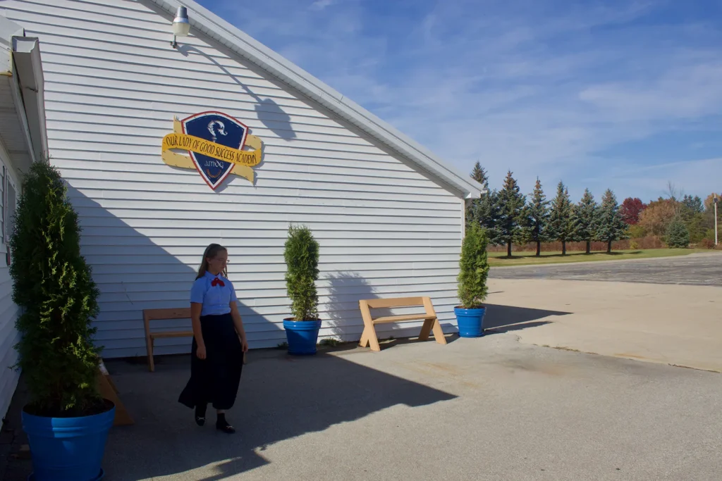 Student walking outside of Our Lady of Good Success Academy