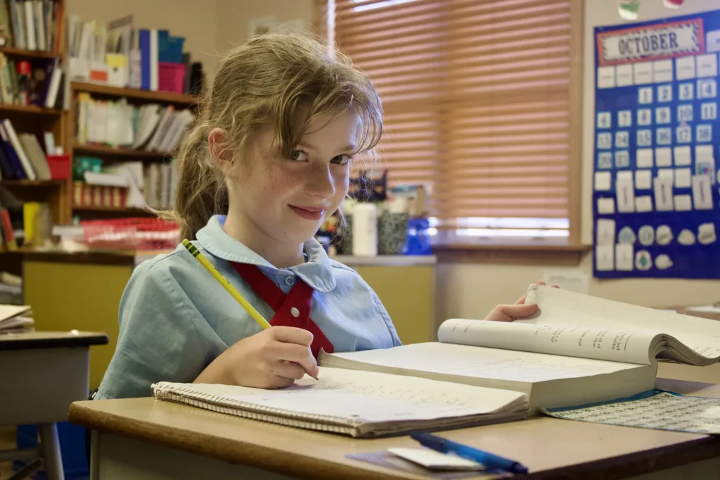 Young student reading at desk