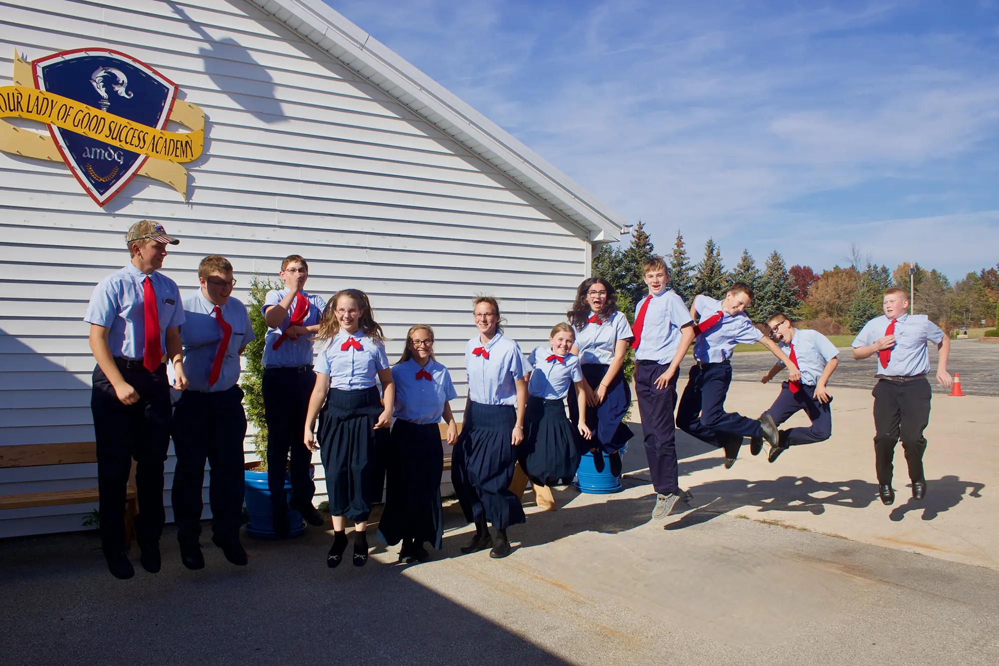 Students outside the Academy on a sunny day